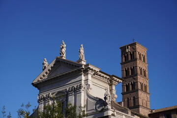 statues on top of a building in Rome, Italy