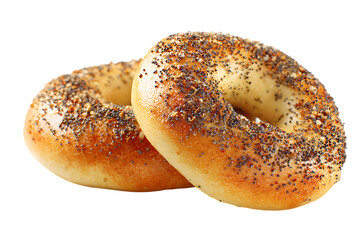 Two everything bagels on a dark background.