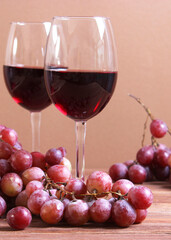 red wine and grapes on the table top view.. Vertical photo format