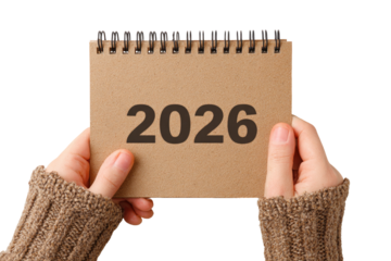 Hands holding a kraft paper calendar with the year 2026 displayed