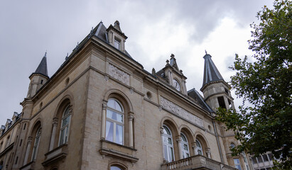 Low angle view of a historic building in Luxembourg City, showcasing its intricate architecture and...