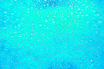 beautiful background background with water drops on glass and streaks of blue, bluish and sky blue colors and shades