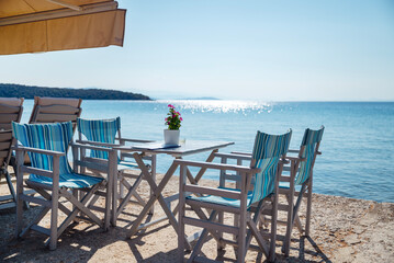 Traditional Greek Sea outdoor restaurant with sea view 