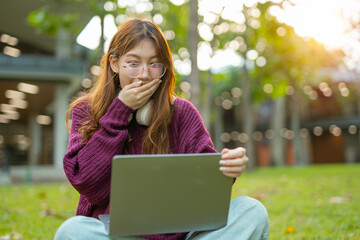 Study of portraits and female students at a university park to learn or study, scholarship books and laptops.