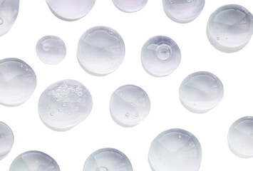 Liquid gel cosmetic drops with bubbles on isolated white background translucent backdrop.