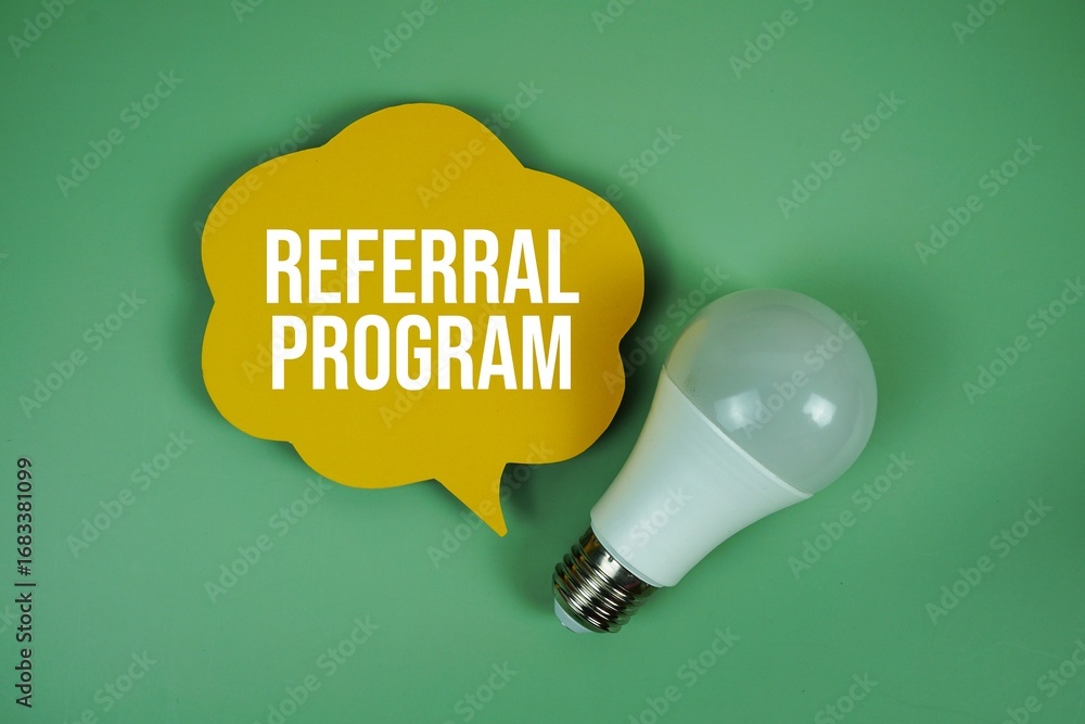 Poster referral program text with light bulb on green background