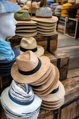 Stacks of straw  hats in hat store 