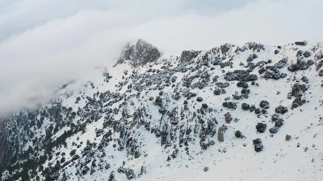 Aerial view of heavy snowfall over the mountains of the village of Castell de Castells in the province of Alicante, Spain.