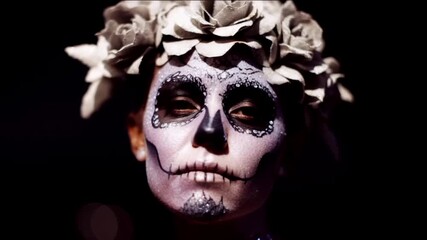 A woman with intricate Day of the Dead makeup, a floral crown adds an ethereal touch, capturing the essence of Mexican culture and tradition, shadows enhance the mystical atmosphere - Powered by Adobe