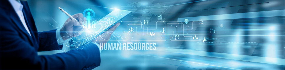 The HR manager team is using a tablet and analysis. human resources data, recruitment onboarding automation payroll performance evaluation compliance workforce training, and engagement.
