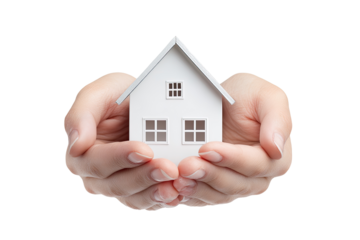 A small white house model cradled gently in two hands