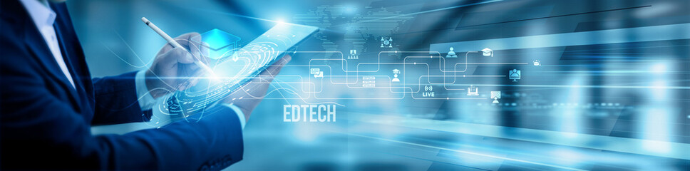 The EdTech coordinator team is using tablets and analyzing educational technology platforms,...