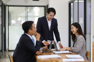 Businessman manager is meeting with colleagues to present new business project. Business meeting in conference room at office.