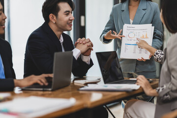 Meeting with a business consultant is discussing analyzing the sales situation and planning the company's finances. Strategy analysis and business planning.