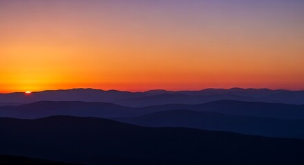 Obraz premium Breathtaking Sunset Over Mountain Range with Vibrant Sky Colors