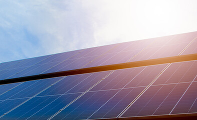Photovoltaic solar power panel on blue sky ,green clean alternative energy. environmentally...