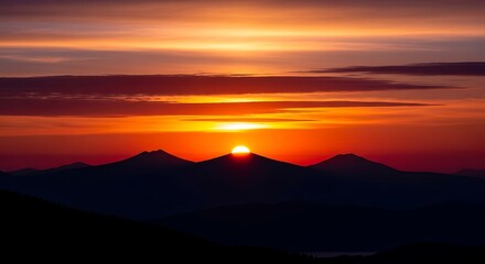 Obraz premium Stunning Mountain Sunset Scene with Vibrant Sky and Peaceful Horizon