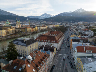 Innsbruck at evening, Aerial Drone Shot of a Beautiful winter City Skyline, Surrounded by Alps Mountains in Austria
