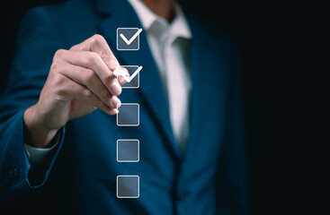 Business performance checklist, businessman using laptop doing online checklist survey, filling out...