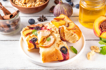 Tasty fruit dessert Focaccia. Sweet viral italian Focaccia open pie, with various seasonal autumn...
