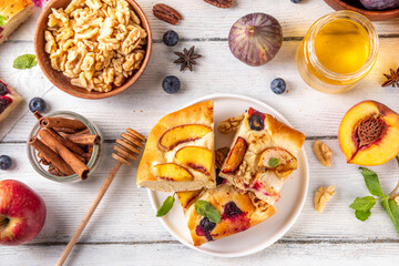 Tasty fruit dessert Focaccia. Sweet viral italian Focaccia open pie, with various seasonal autumn...