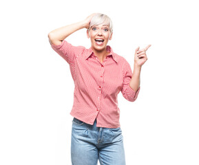 Surprised adult woman pointing with forefinger to copy space for your text or image, isolated on white background. I know, this secret is discovered.