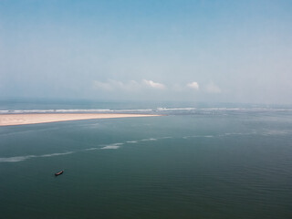 Aerial view of coxs bazar longest sea beach.Marine Drive aerial shot from top with boats.Drone shot...