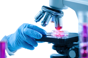 Scientist using a microscope to examine a slide