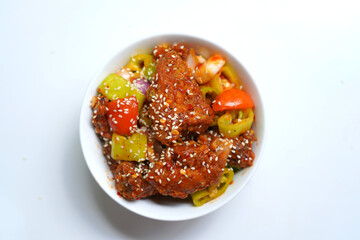 Tasty and Spicy Devil Chicken in White Bowl.