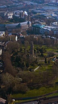 Vertical 4K drone video over Bristol&rsquo;s Brandon Hill and Cabot Tower, revealing the Harbourside skyline and green parkland. Mobile - first aerial for travel, tourism and urban heritage stories.