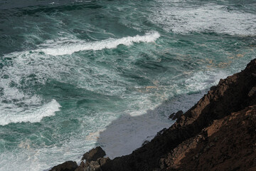 Waves crashing on rocks