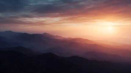 Obraz premium Golden hour light bathes a majestic mountain range at sunset or sunrise creating a serene and colorful landscape with layered peaks and a vibrant sky