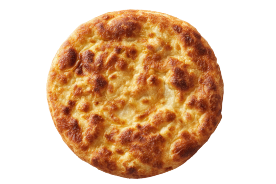 Overhead view of a golden-brown, round flatbread, showing a slightly uneven, mottled top surface with a browned crust