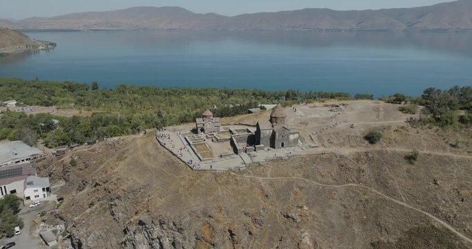 Aerial view of the ancient Sevanavank Monastery perched atop a hill overlooking the serene blue waters of Lake Sevan, Lake Sevan, Gegharkunik Province, Armenia.