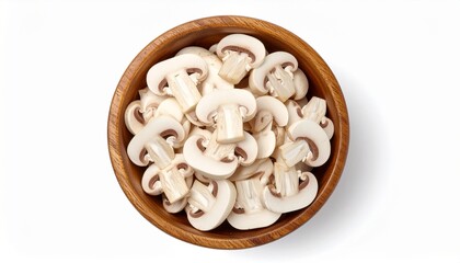 Top view of fresh sliced champignon mushrooms in a wooden bowl, isolated on a white background.