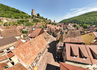 Aerial Drone Shot of the Streets in village of Kaysersberg in Alsace in a day. Summer in France, Castle above