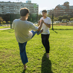 Young martial artists practicing a precise kick.