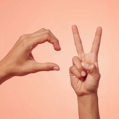 Two hands forming letters, one making a "C" and the other a "V" sign, against a peach background.