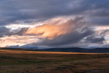 Altai, Ukok Plateau. Clouds after a thunderstorm.