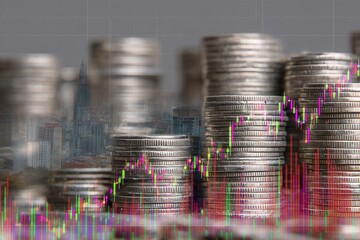 Stacks of coins with financial charts overlaid on a cityscape background