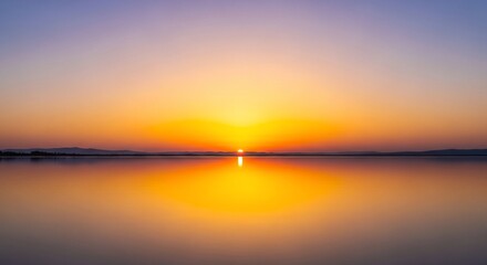 Naklejka premium Calm, tranquil sunset over a still lake, reflecting the fiery colors of the sky.