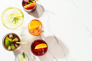 Alcohol cocktail drinks at white background.