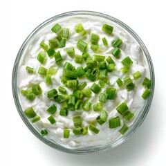 Creamy dip in a glass bowl topped with chopped green onions