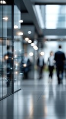 Obraz premium Individuals stroll along a sleek pathway featuring vibrant digital panels displaying various data and information in an urban environment