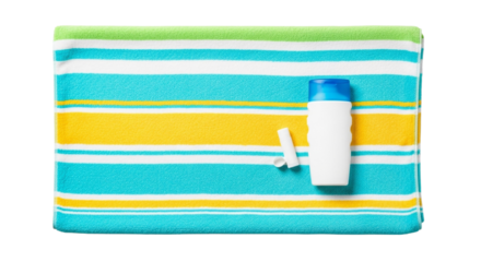 Sunscreen bottle and cap on a striped beach towel featuring blue yellow green and white colors