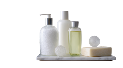 White and light-yellow cosmetic bottles and bar soap on marble tray