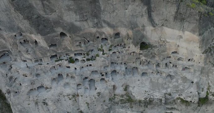 Aerial view of the ancient cave city of Vardzia carved into the Erusheti Mountain, a testament to history's enduring mark, Gogasheni, Samtskhe-Javakheti, Georgia.