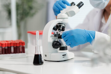 Scientist mixing chemicals in a lab experiment.