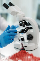Scientist mixing chemicals in a lab experiment.