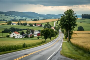 Scenic country road winding through rolling hills and farms